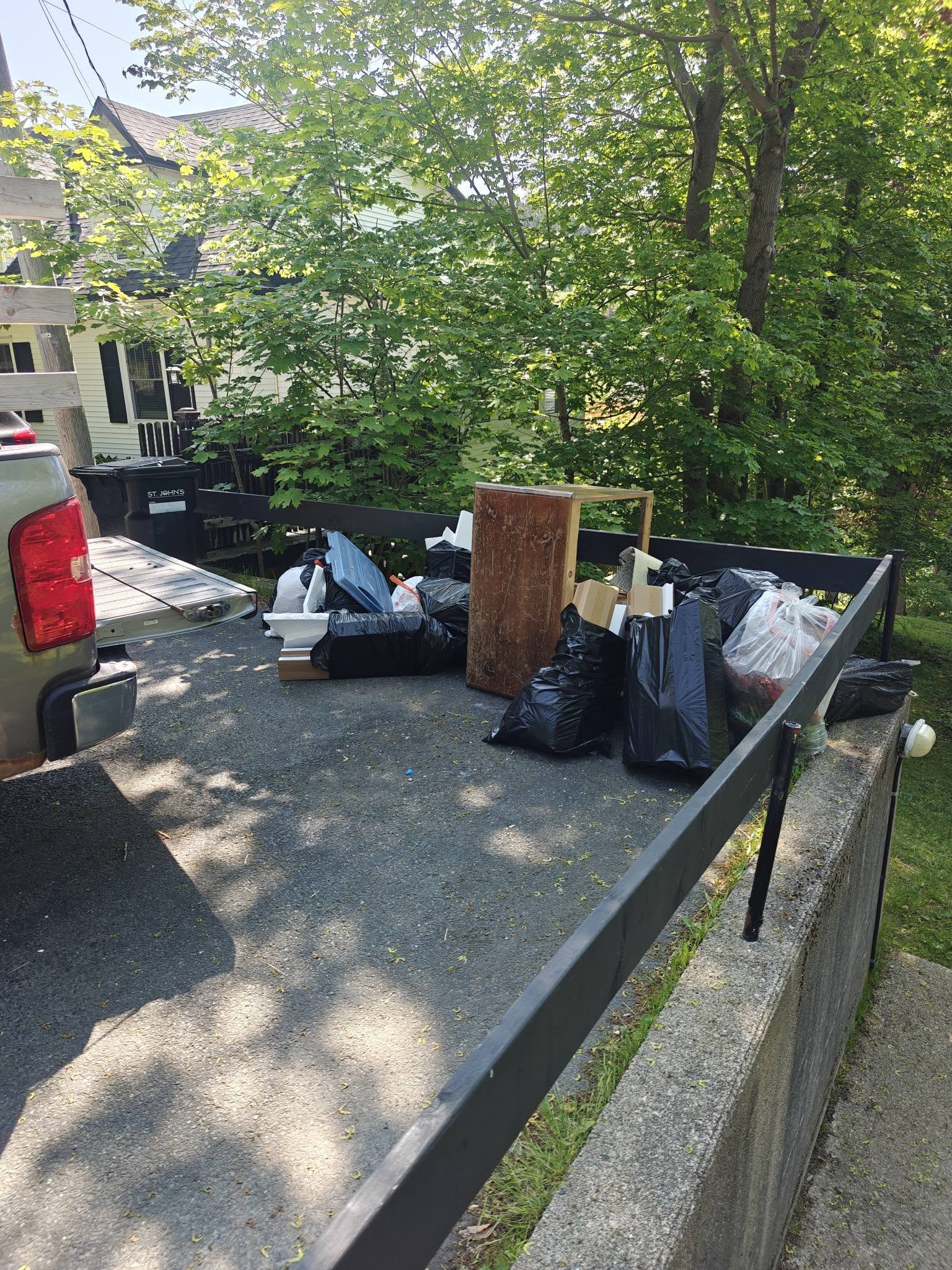 FareShare junk removal truck loaded with residential junk in St. John's NL