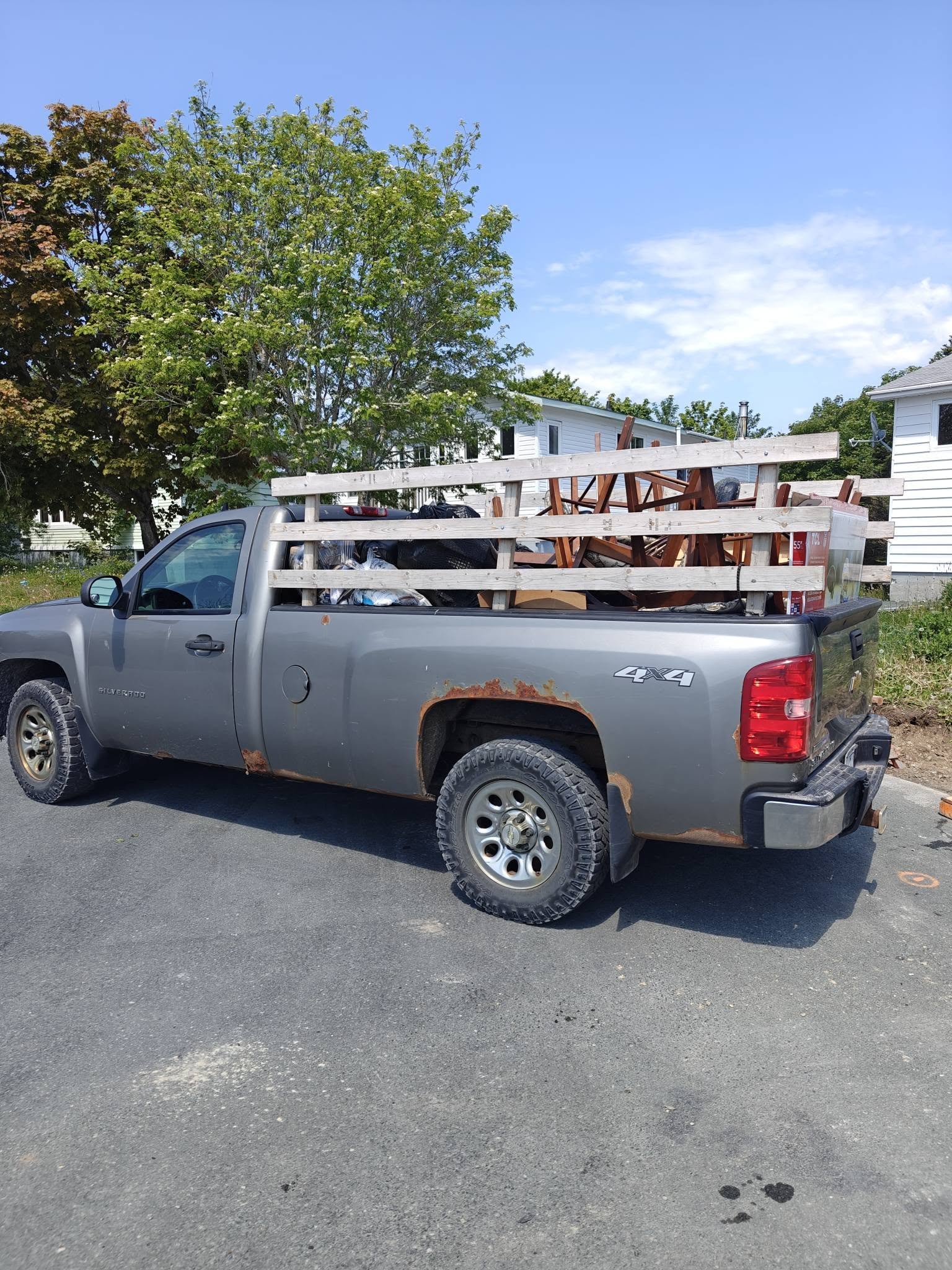 FareShare Silverado truck loaded after junk hauling job in St. John's